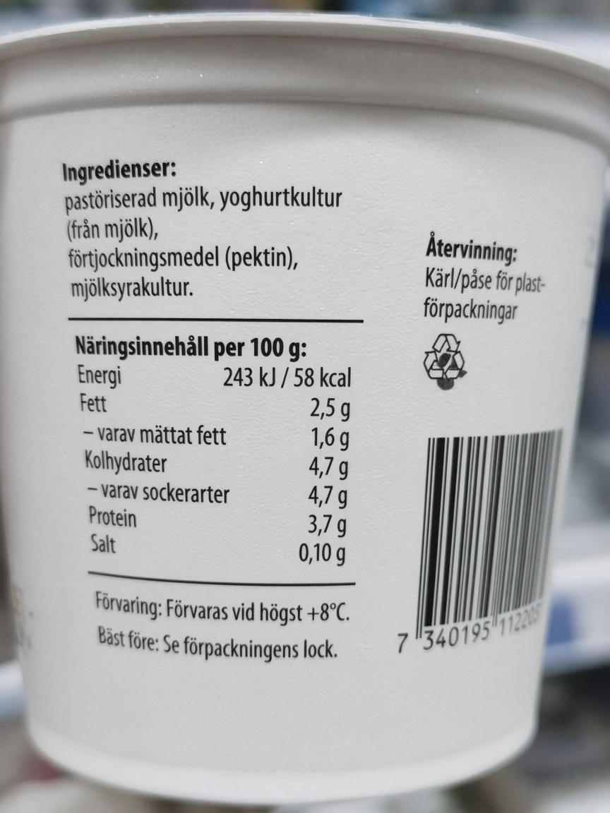 Back of a yoghurt pot, showing the ingredient list.